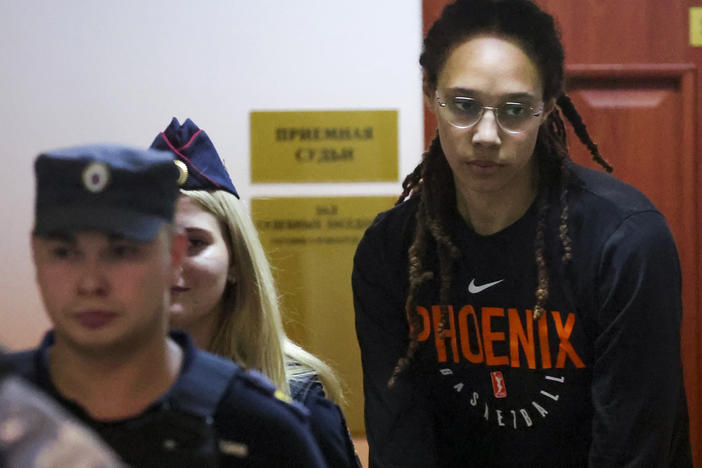 WNBA star and two-time Olympic gold medalist Brittney Griner is escorted to a courtroom for a hearing, in Khimki just outside Moscow, on Wednesday.