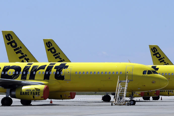 A line of Spirit Airlines jets sit on the tarmac at the Orlando International Airport on May 20, 2020, in Orlando, Fla.