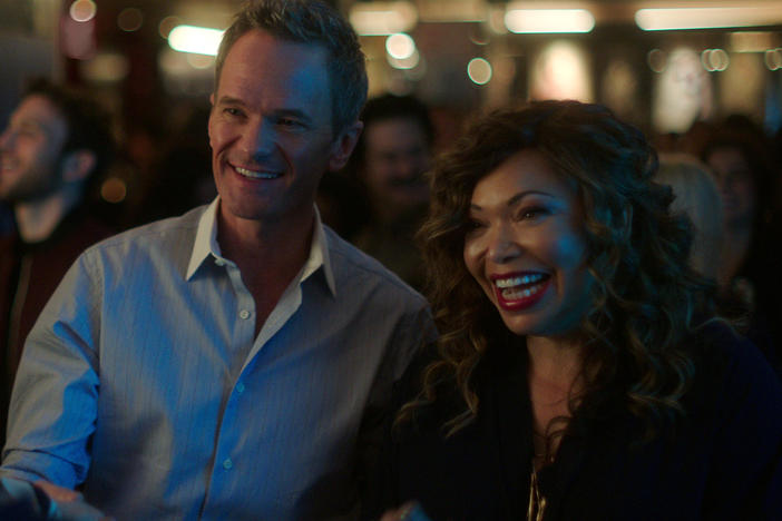 (L to R) Michael (Neil Patrick Harris) and pal Suzanne (Tisha Campbell) schmooze a prospective client.