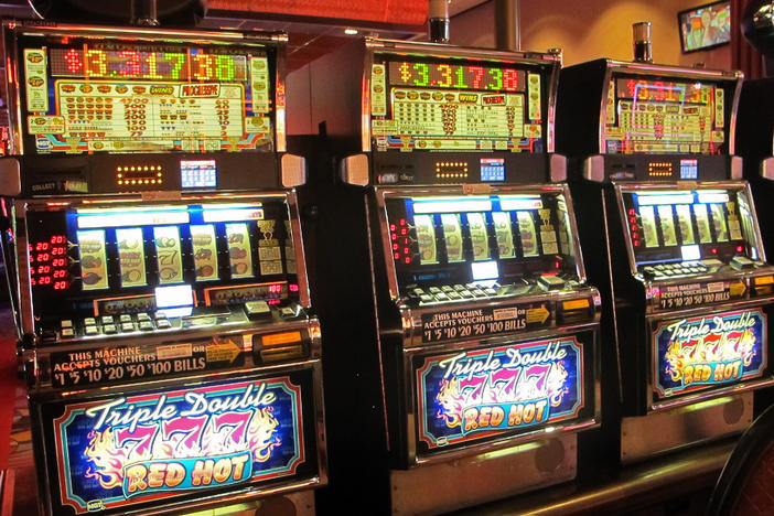 In this June 23, 2021 photo, a row of slot machines sit empty at Bally's casino in Atlantic City N.J.