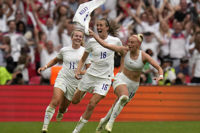 England's Chloe Kelly, right, celebrates after scoring her side's second goal during the women's Euro 2022 final soccer match against Germany at London's Wembley stadium on Sunday.