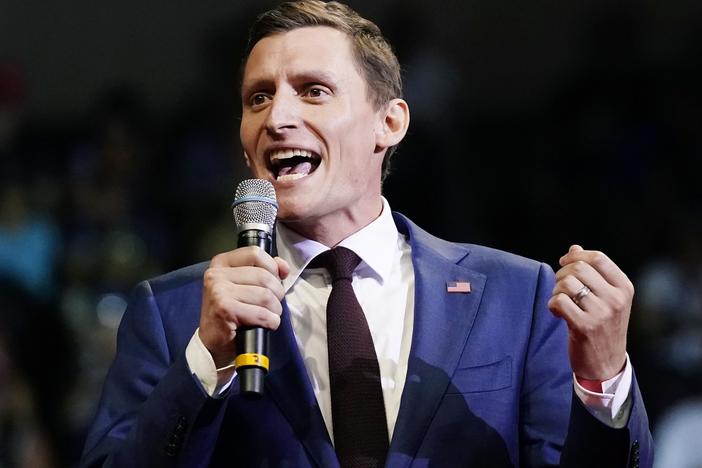 Blake Masters, a Republican candidate for U.S. Senate in Arizona, speaks at a rally hosted by former President Donald Trump on July 22 in Prescott, Ariz. The Trump-backed Masters is aiming to challenge Democratic Sen. Mark Kelly in the fall.