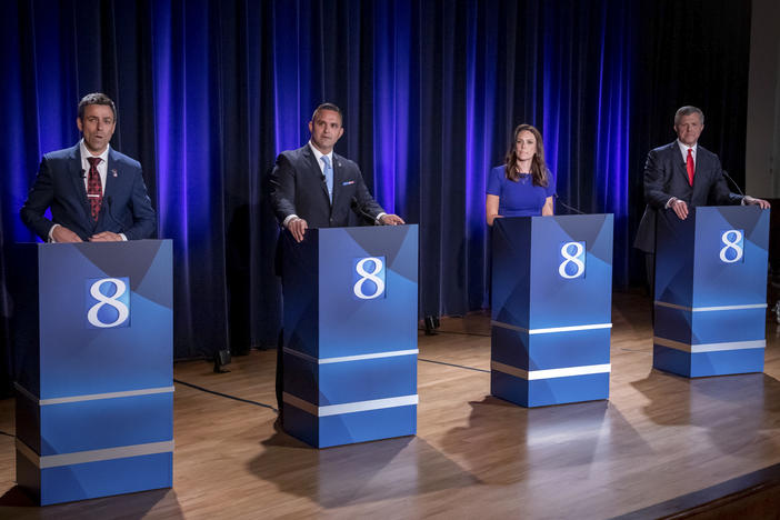 Michigan Republican candidates for governor Ryan Kelley, from left, Garrett Soldano, Tudor Dixon and Kevin Rinke appear at a debate in Grand Rapids, Mich., July 6, 2022.