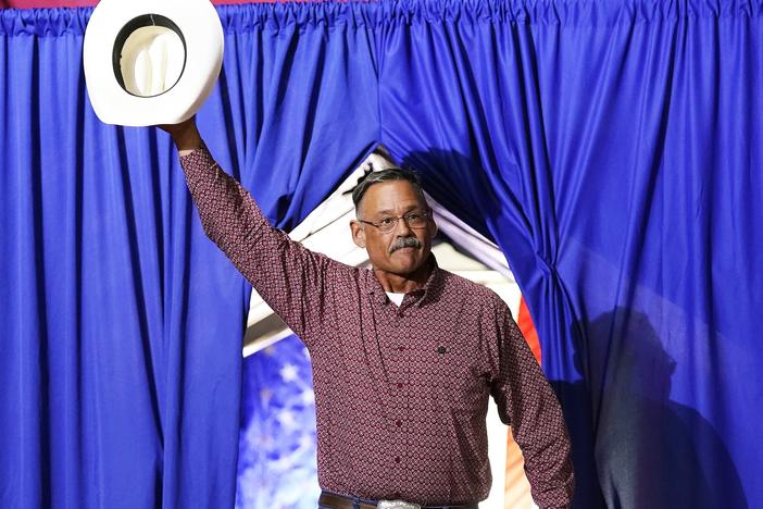 Mark Finchem, a Republican candidate for Arizona secretary of state, waves to the crowd as he arrives to speak at a rally put on by former President Donald Trump in Arizona on July 22.