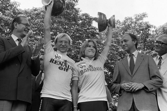 Marianne Martin stands alongside fellow Tour de France winner Laurent Fignon on the podium in Paris on July 22, 1984. Martin received around $1,000 for her win; Fignon got more than $100,000.