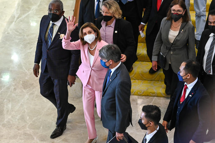 This photo from Malaysia's Department of Information, U.S. House Speaker Nancy Pelosi, center, waves to media as she tours the parliament house in Kuala Lumpur, Tuesday, Aug. 2, 2022.