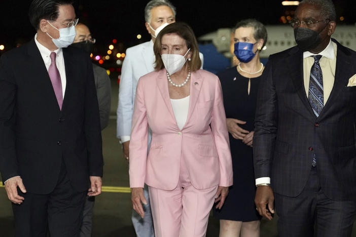 In this photo released by the Taiwan Ministry of Foreign Affairs, U.S. House Speaker Nancy Pelosi walks with Taiwan's Foreign Minister Joseph Wu as she arrives in Taipei, Taiwan, on Tuesday, despite threats from Beijing of serious consequences, becoming the highest-ranking American official to visit the self-ruled island claimed by China in 25 years.