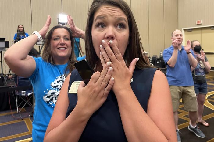 Kansas state Rep. Stephanie Clayton, an abortion rights supporter who was a Republican and is now a Democrat, reacts as a referendum to strip abortion rights out of the state constitution fails.