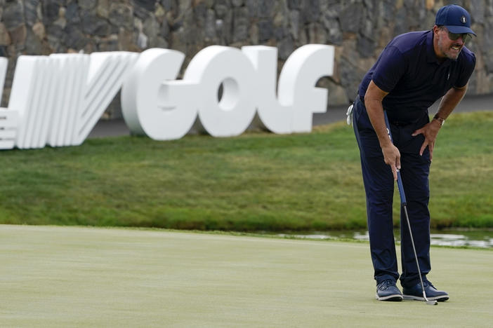 Phil Mickelson lines up a shot on the 18th hole during the first round of the Bedminster Invitational LIV Golf tournament in Bedminster, N.J., on Friday.