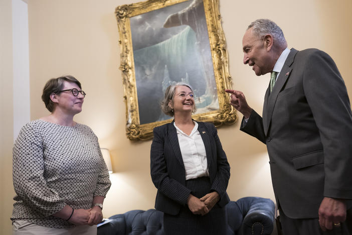 Senate Majority Leader Chuck Schumer, D-N.Y., right, welcomes Paivi Nevala, minister counselor of the Finnish Embassy, left, and Karin Olofsdotter, Sweden's ambassador to the U.S., on Wednesday, Aug. 3, 2022.