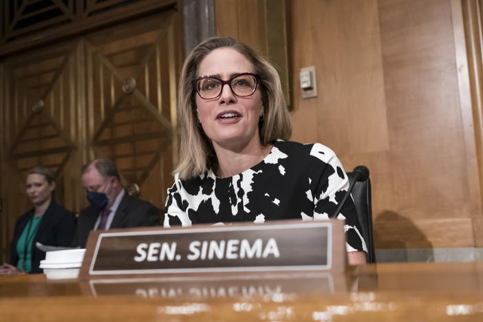 Sen. Kyrsten Sinema, D-Ariz., said Thursday that she would "move forward" with Senate Democrats' spending bill to tackle climate change, health care and tax reforms.
