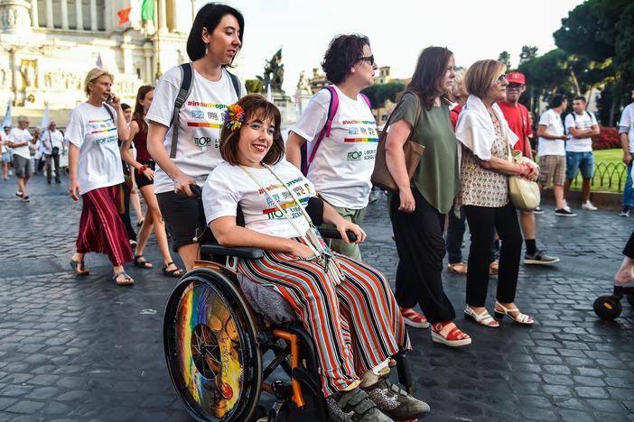 People take part in a disability pride parade on July 14, 2019, in central Rome.