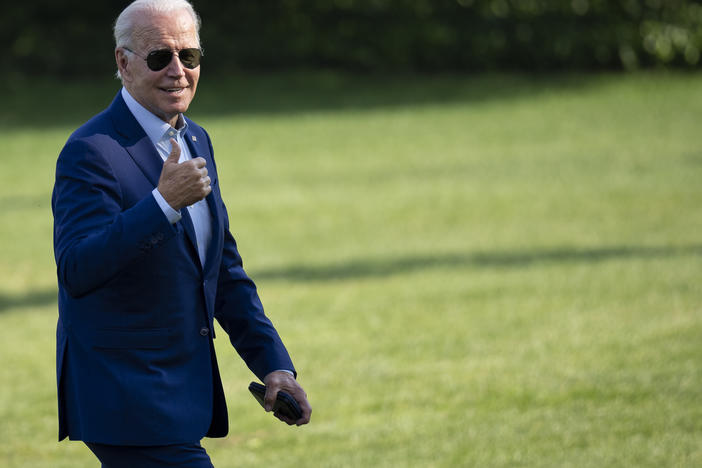 President Joe Biden gestures toward reporters as he departs Marine One and walks to the Oval Office on the South Lawn of the White House on July 20.