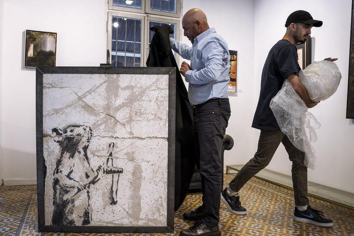A painting by the secretive British graffiti artist Banksy that was mysteriously transferred from the occupied West Bank to the Urban Gallery in Tel Aviv, Israel, is shown on Thursday, Aug. 4, 2022.