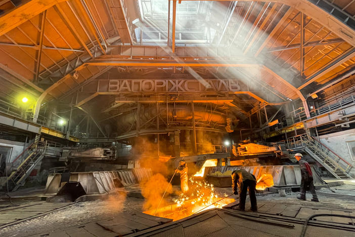 Workers at Zaporizhstal iron and steel works on July 22 in Zaporizhzhia, Ukraine.