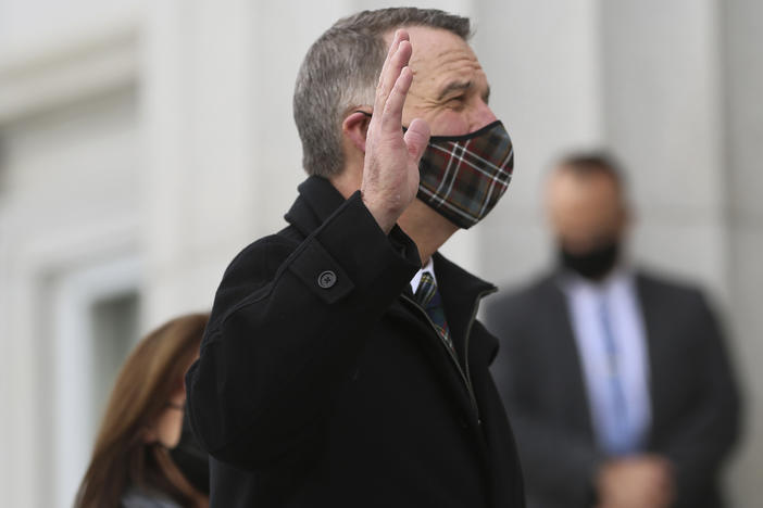 Thursday, Jan. 7, 2021, Republican Gov. Phil Scott wears a mask as he takes the Oath of Office on the steps of the Vermont Statehouse in Montpelier, Vt., beginning his third two-year term. Vermont is one of two states that holds elections for governor every two years.