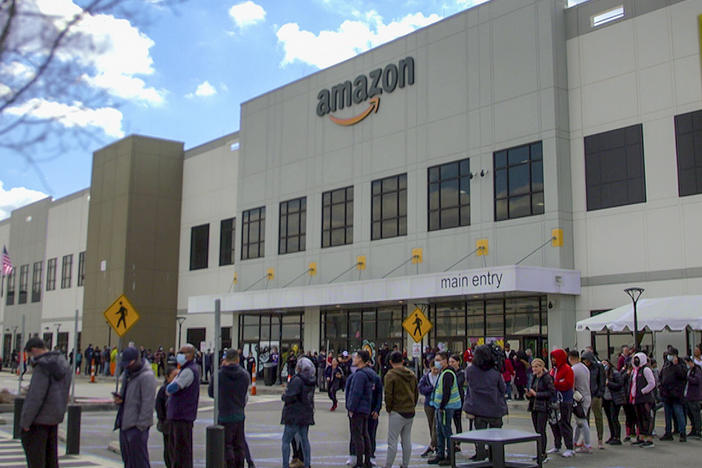 Workers line up to vote on unionization at Amazon's warehouse in Staten Island on March 25.
