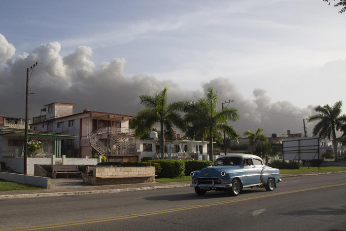 Smoke rises from a deadly fire at a large oil storage facility in Matanzas, Cuba, on Tuesday. The fire was triggered by lighting that struck one of the facility's eight tanks late Friday.