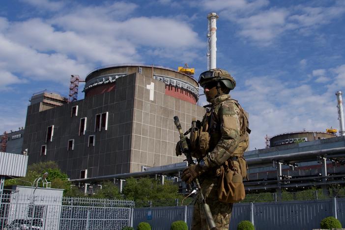 A Russian serviceman patrols Zaporizhzhia Nuclear Power Station on May 1. A series of exchanges in recent weeks has made conditions at the plant more dangerous.