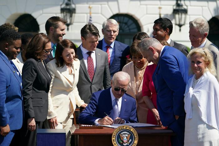 President Biden signed the CHIPS and Science Act on the South Lawn of the White House on Tuesday. The legislation is aimed at boosting the domestic production of semiconductors.