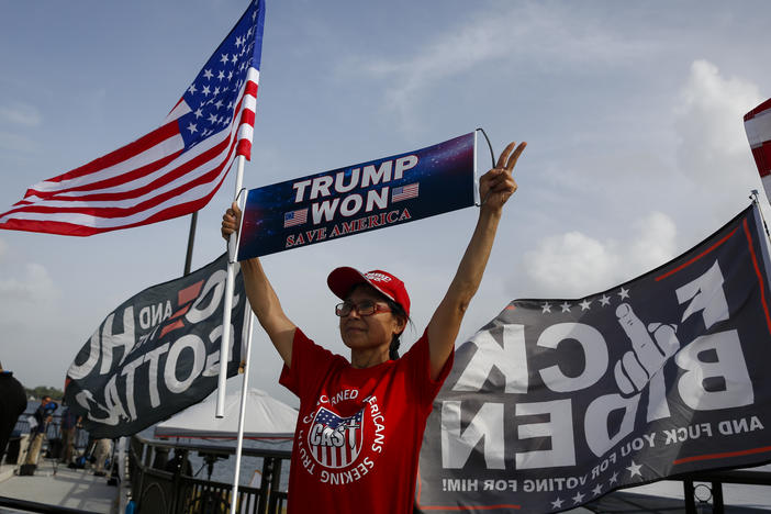 Supporters of former US President Donald Trump outside Mar-A-Lago in Palm Beach, Florida, US, on Tuesday, Aug. 9, 2022. Donald Trump faces intensifying legal and political pressure after FBI agents searched his Florida home in a probe of whether he took classified documents from the White House when he left office, casting a shadow on his possible run for the presidency in 2024.