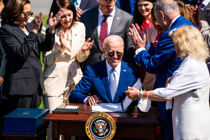 President Joe Biden signs into law the CHIPS and Science Act of 2022 on the South Lawn of the White House on Aug. 9, 2022.