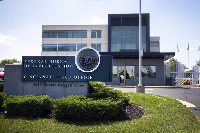 The entrance to the FBI headquarters in Cincinnati is shown on Thursday. An armed man decked out in body armor tried to breach a security screening area at the field office, then fled and exchanged gunfire in a standoff with law enforcement, authorities said.