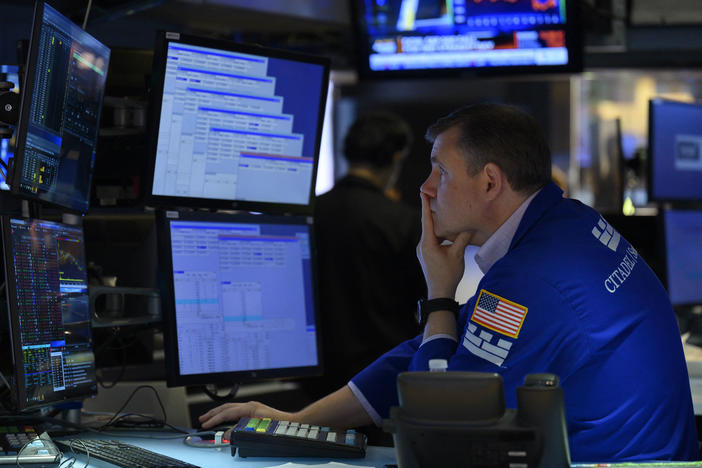 A trader works on the floor of the New York Stock Exchange in New York City on Aug. 5. The majority of America's top companies have reported strong earnings, but warning signs about the economy are also emerging from their corporate earnings.