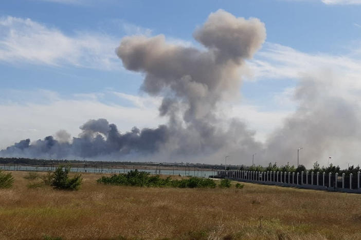 Smoke rises after explosions were heard from the direction of a Russian military airbase near Novofedorivka, Crimea, in this still image obtained by Reuters Tuesday.