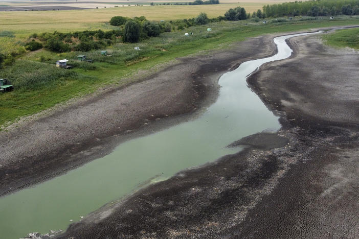A view of a dry lake bed near the village of Conoplja, 150 kilometers north-west of Belgrade, Serbia, Tuesday, Aug. 9, 2022.