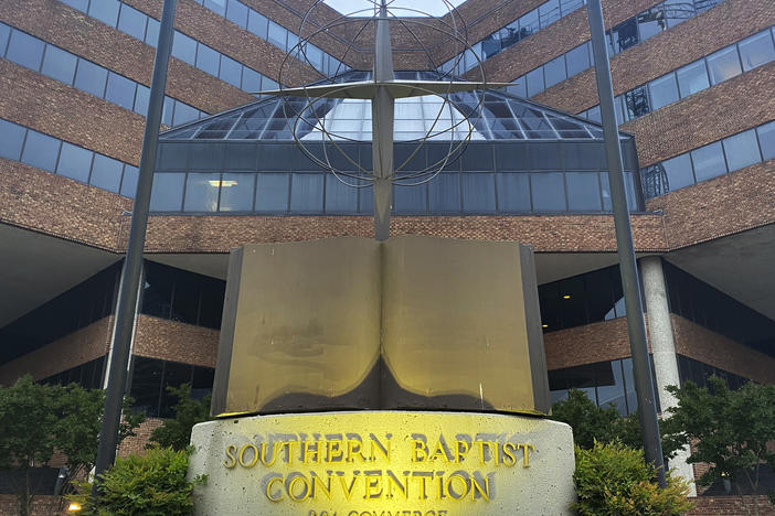 A cross and Bible sculpture stand outside the Southern Baptist Convention headquarters in Nashville, Tenn., on May 24. The Executive Committee of the Southern Baptist Convention says that several of the denomination's major entities are under investigation by the U.S. Department of Justice.