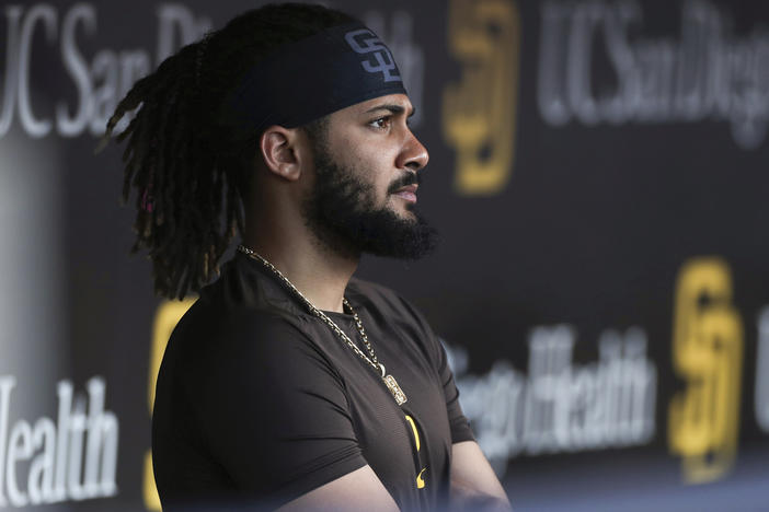 San Diego Padres' Fernando Tatis Jr. looks out from the dugout prior to the team's game against the Philadelphia Phillies on June 25 in San Diego. Tatis was suspended 80 games by Major League Baseball on Friday after testing positive for a performance-enhancing substance.