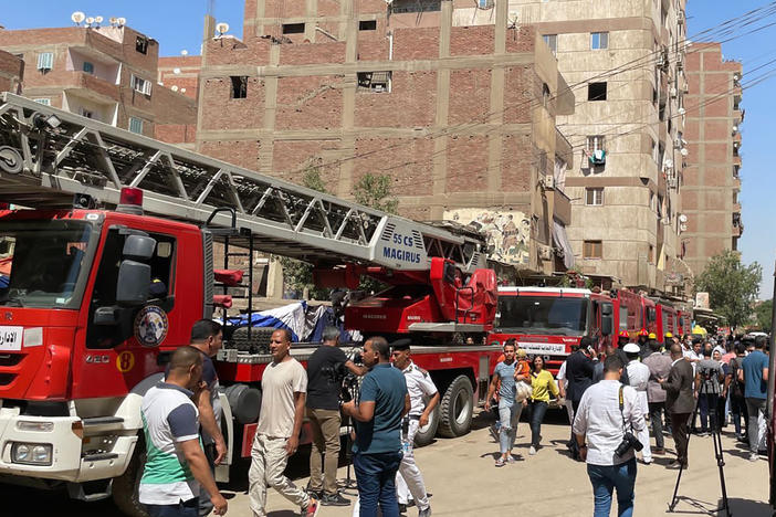 Emergency personnel work at the site of a fire at the Abu Sefein church that killed over 40 people and injured at least 14 others, in the densely populated neighborhood of Imbaba in Cairo.
