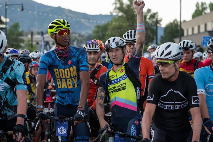 Activist and transgender cyclist Molly Cameron, third from right, next to former NBA player Reggie Miller, second from left, before the SBT GRVL race.