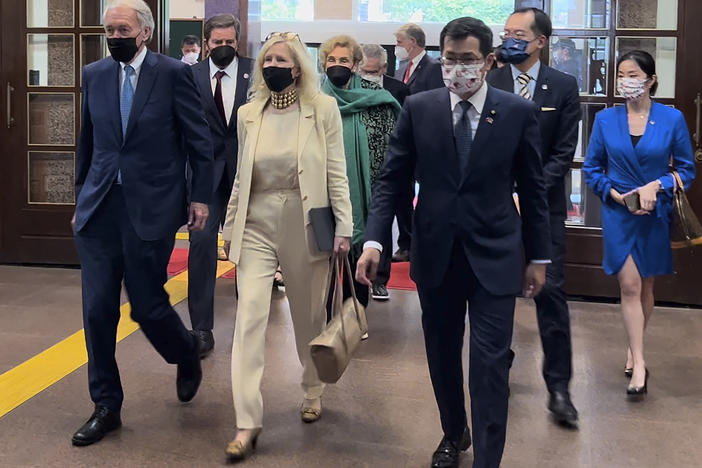 U.S. Democrat Sen. Ed Markey of Massachusetts, left, and Democratic House member John Garamendi of California, second left, back, arrive with their wives at the parliament building in Taipei, on Aug. 15, 2022.