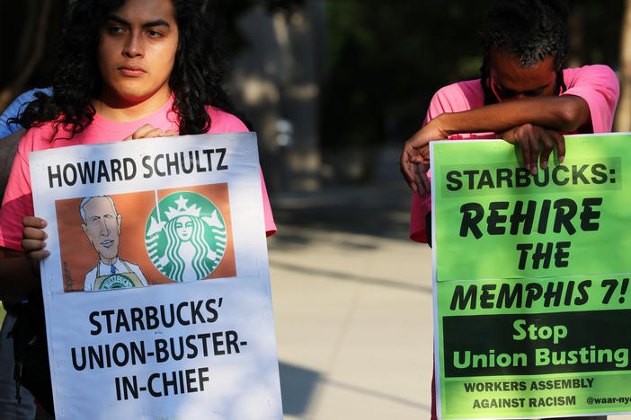 Starbucks says regional staff of the National Labor Relations Board repeatedly crossed the line of neutrality to help union organizers in Kansas. Here, activists protest against Starbucks CEO Howard Schultz in New York City last month.