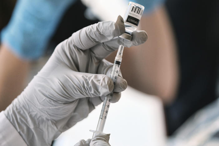 Registered pharmacist Sapana Patel, loads a syringe with monkeypox vaccine at a pop-up vaccination site on Wednesday, Aug. 3, 2022, in West Hollywood, Calif.