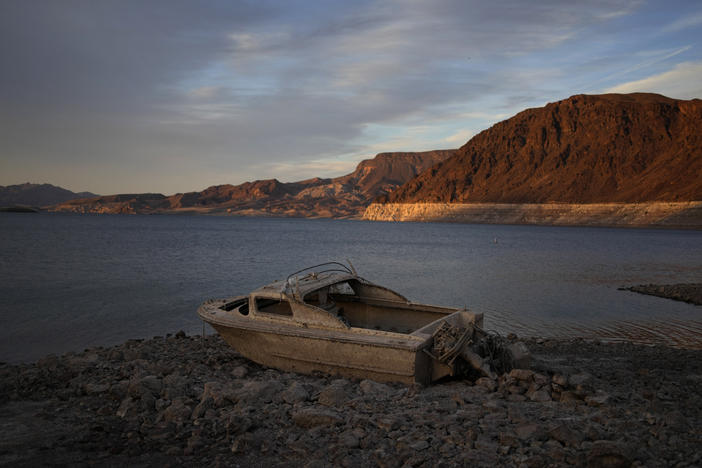 A formerly sunken boat sits high and dry along the shoreline of Lake Mead at the Lake Mead National Recreation Area, on May 10, near Boulder City, Nev.