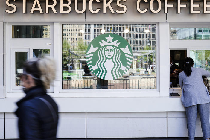 A customer makes a purchase at a Starbucks coffee shop.