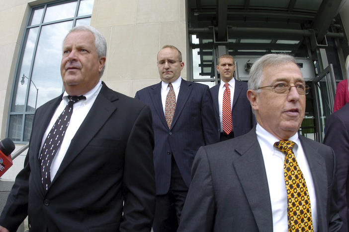 Former Luzerne County Court Judges Michael Conahan, front left, and Mark Ciavarella, front right, leave the United States District Courthouse in Scranton, Pa., in 2009. The two Pennsylvania judges who orchestrated a scheme to send children to for-profit jails in exchange for kickbacks were ordered to pay more than $200 million to hundreds of children who fell victim to their crimes.