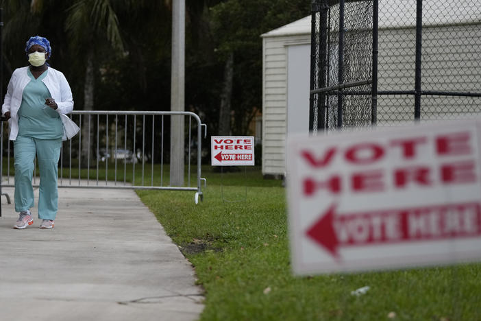 A voter leaves after casting her ballot in a special congressional election on Jan. 11 in Miramar, Fla.