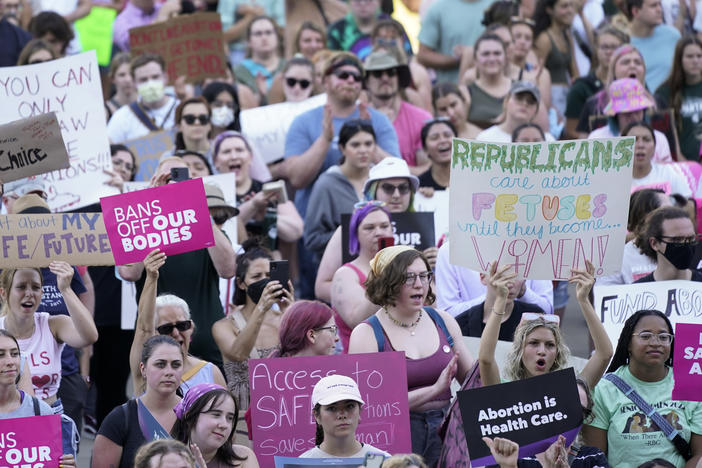 Abortion rights protesters attend a June 24 rally following the United States Supreme Court's decision to overturn <em>Roe v. Wade</em>.