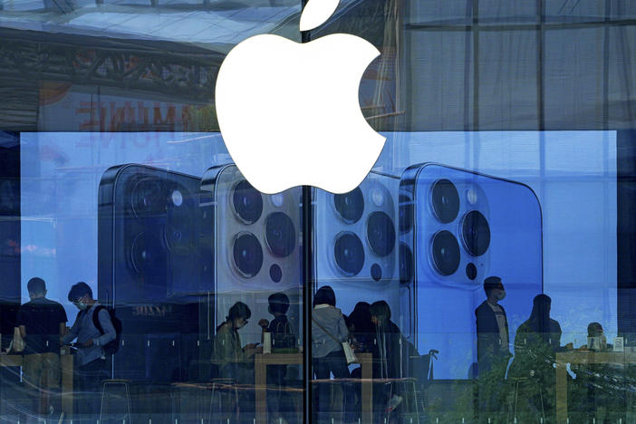 People shop at an Apple Store in Beijing on Sept. 28, 2021. Apple has disclosed serious security vulnerabilities for iPhones, iPads and Macs that  could potentially allow attackers to take complete control of these devices.