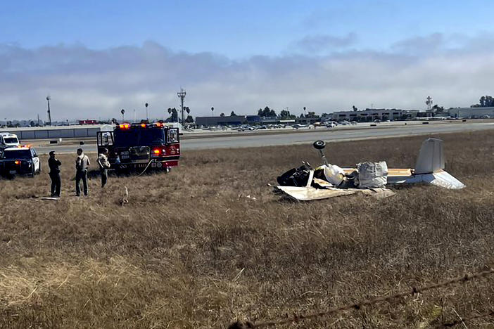 This photo provided by KION-TV shows multiple agencies responding to Watsonville Municipal Airport, in Santa Cruz County, Calif. after 2 planes attempting to land collided on Thursday, Aug. 18, 2022.