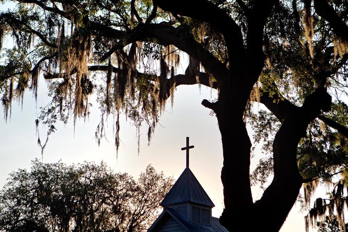 The sun rises behind St. Luke Baptist Church in Hog Hammock, a Geechee community on Sapelo Island, Ga., on May, 17, 2013.