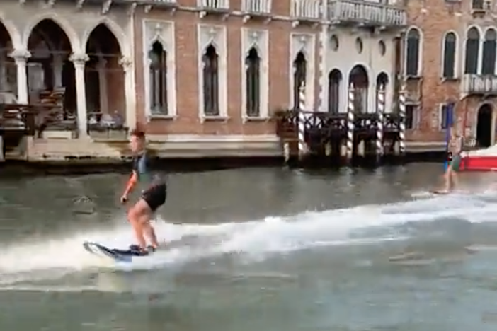 The mayor of Venice, Italy, mobilized a search for two people who used motorized surfboards to cruise down the picturesque city's canals. Now the pair are facing large fines.