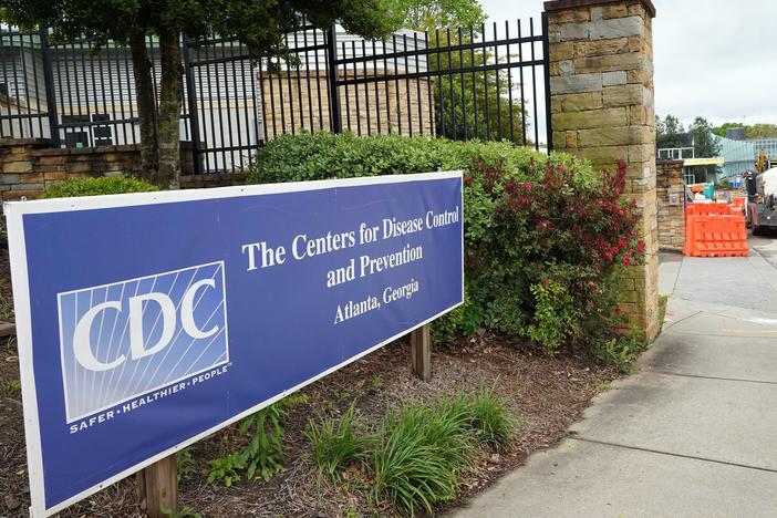 A sign is seen by the entrance of the Centers for Disease Control and Prevention in Atlanta on April 23, 2020. The CDC said it is investigating an <em>E. coli</em> outbreak in four states that has sickened at least 37 people.