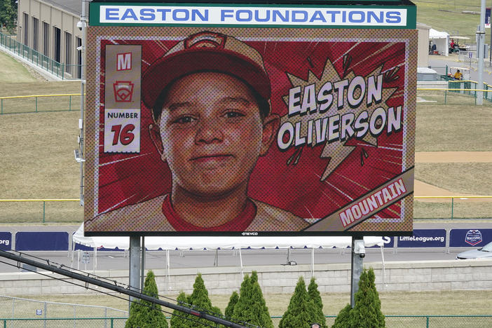 A picture of Mountain Region Champion Little League team member Easton Oliverson, from Santa Clara, Utah, is shown on the scoreboard at Volunteer Stadium during the opening ceremony of the 2022 Little League World Series baseball tournament in South Williamsport, Pa., on Wednesday.