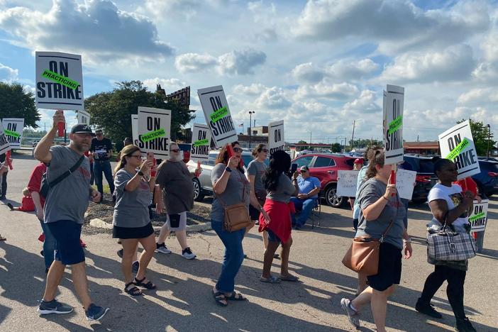 Members of the Columbus Education Association rally earlier this summer ahead of their vote this past Sunday night to officially strike this week.