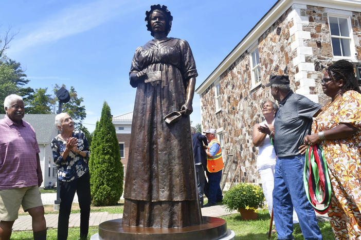 A monument of civil rights pioneer Elizabeth Freeman is unveiled in front of Sheffield's Old Parish Church in Sheffield, Mass., Sunday, Aug. 21, 2022.